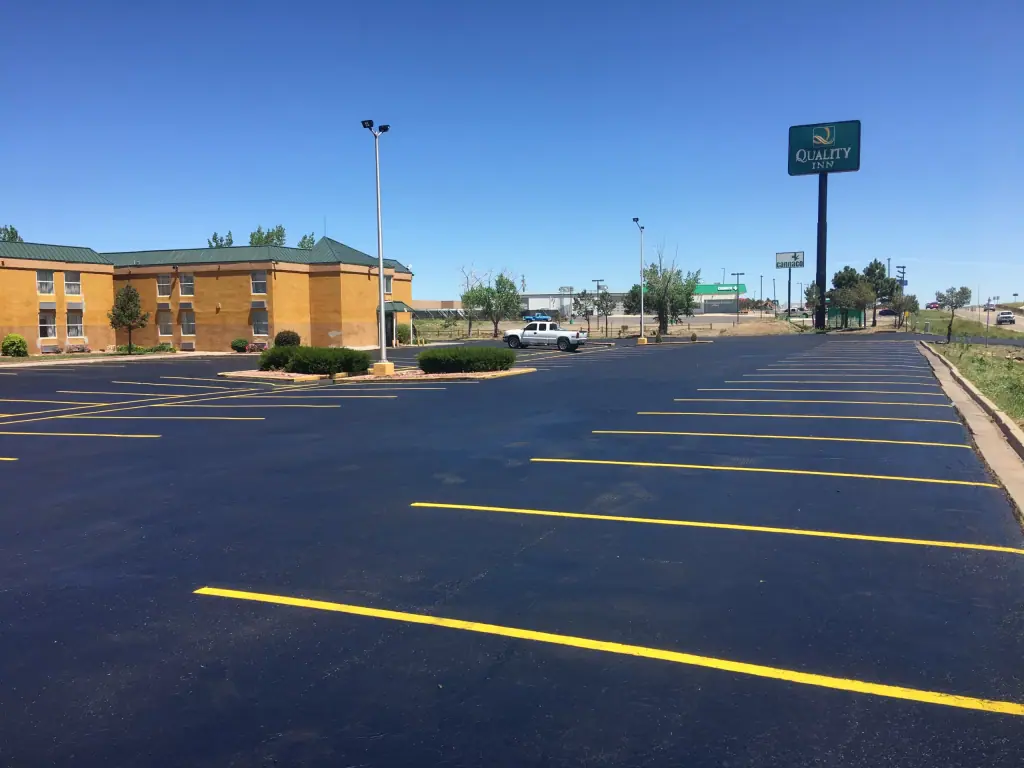 Sealcoated hotel parking lot with fresh yellow striping